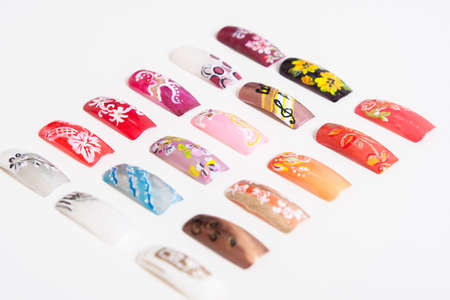A set of artificial nails. Women's manicure. Nails on a white background. Photos for nail booklet.の写真素材