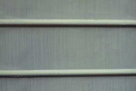 Paint smudges on the surface. The old gray background. Painted metal surface. The surface of the train as a background element. Metal painted gray.の写真素材