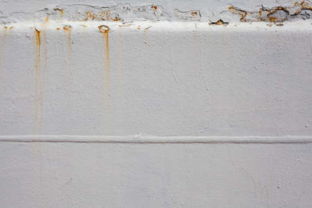 Rusty white background. Paint smudges on the surface. Painted metal surface. The surface of the train as a background element. Metal painted in white color. Destruction of metal due to corrosionの写真素材