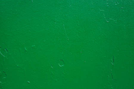 The green background. Painted metal surface. Metal painted green. Iron plates welded togetherの写真素材