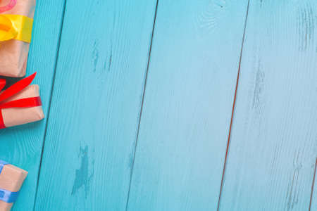 Turquoise background for Christmas cards. Blue wooden planks. Vintage background for congratulation. Holiday gift. Rotated view with flashの写真素材