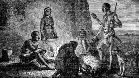 Victorian engraving of indigenous African hunters at a campfireの写真素材