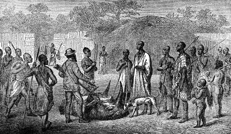 Victorian engraving of an indigenous african village and colonial hunterの写真素材