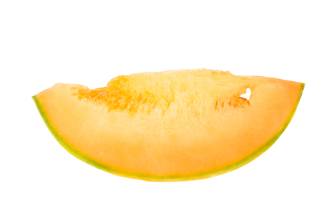 Piece of a melon of orange color on a white backgroundの写真素材