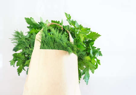 Piece of cheese and small bread with seeds on a white background in horizontal formatの写真素材