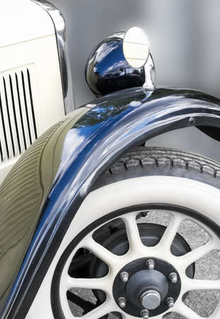 Part of a car with a retro style round mirrorの写真素材