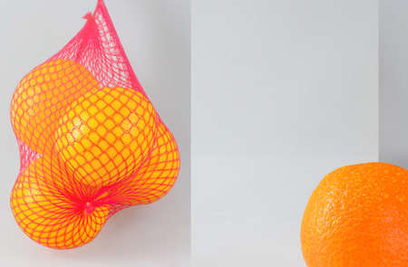 Gray background with a part of an orange with water dropsの写真素材