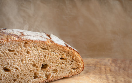 Slice of rye bread on a beige background