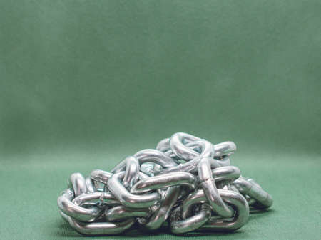 Large chain folded in a pile on the backgroundの写真素材