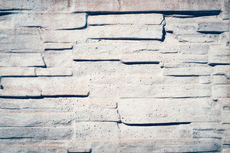 Stone decorative wall of gray color in the sunlightの写真素材