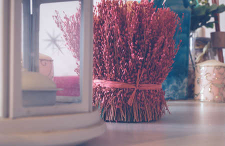 White vintage lantern on a background of red dried flowers. Compositionの写真素材