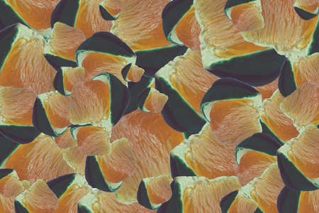 Many pieces of mandarin are arranged in random order.の写真素材