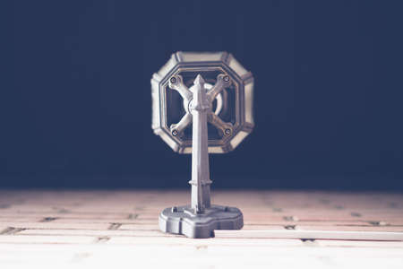 Antique bronze lantern on a brick wall vertically