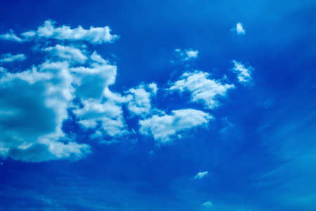 Blue sky with sparse white clouds in clear weather