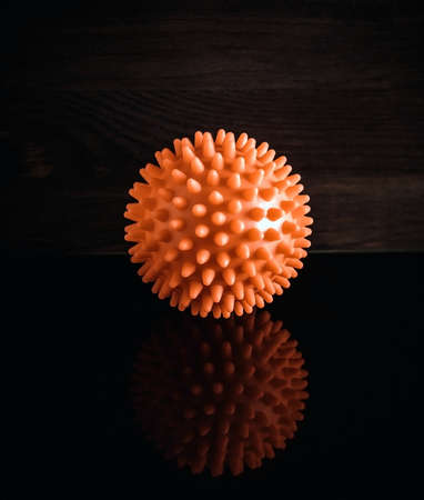 red ball representing coronavirus in reflectionの写真素材