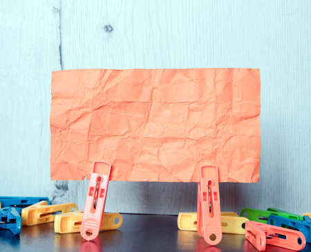 Multiple clamps hold lettering paper
