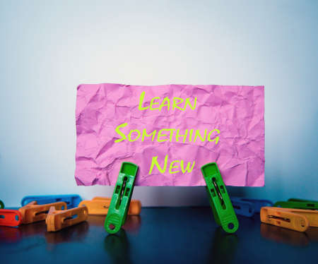 Multiple clamps hold lettering paper