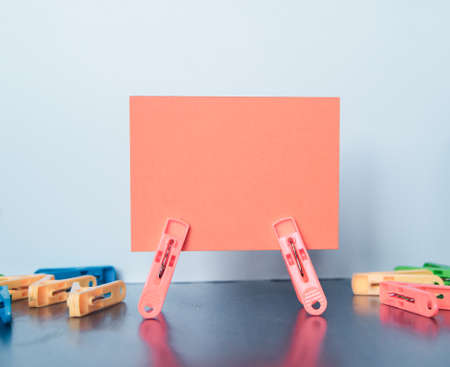 Multiple clamps hold lettering paperの写真素材