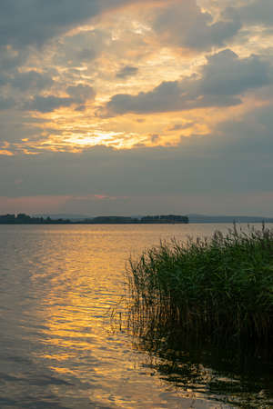 Sun beams or light rays breaking through the clouds. Beautiful spectacular conceptual meditation background.の写真素材
