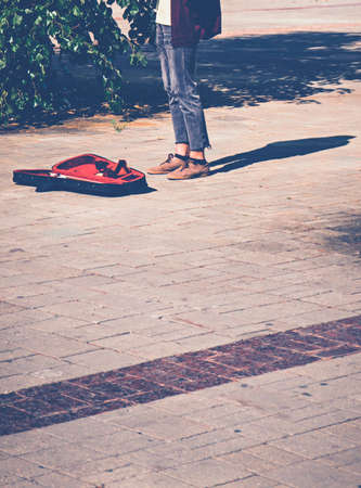 The musician violinist performs classical music for touristsの写真素材