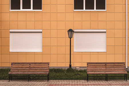 two Light blue wooden bench and wooden wall.の写真素材