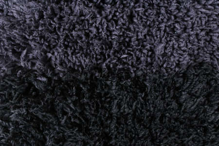Gray black shaggy carpet closeupの写真素材