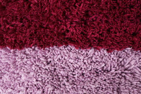 Burgundy pink shaggy carpet closeupの写真素材