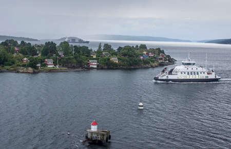 A boat in the Norwegian fjord near the fishing islandの写真素材