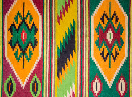 Fragment of antique handmade carpet, Crafts. Woven wool carpet .Folk art.Close up of geometric...