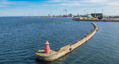 lighthouse on a long pier. Provision of navigationの写真素材