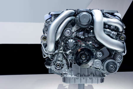 Car engine, concept of modern powerful automobile motor with metal, chrome, plastic parts, white, grey, black lines pattern on backgroundの写真素材