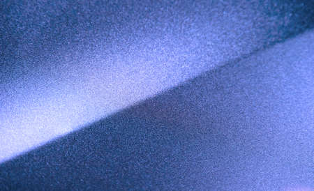Fragment of blue steel car bodywork, vehicle silver paint coating texture, selective focus, abstractの写真素材