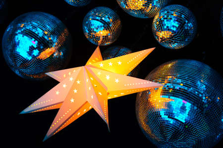 Nightclub blue disco balls and gold glowing star in colorful party lights in dance club, nightlife entertainment industryの写真素材