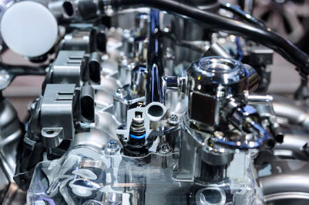 Powerful car engine with metal, chrome, steel, plastic parts of automobile race motor