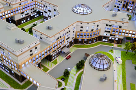 Hospital scale model, layout of medical building, miniature of big city healthcare centre with infrastructure, ambulance service, modern architecture and design, selective focusの写真素材