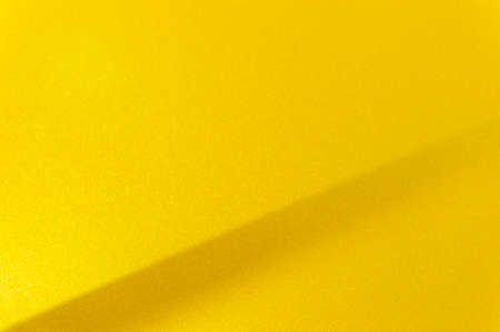 Fragment of yellow steel car bodywork, vehicle silver paint coating texture, selective focus, abstractの写真素材