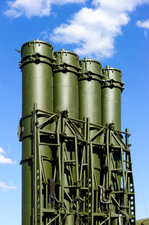 Antiaircraft missile complex, ballistic launcher with big four missiles ready to attack on powerful mobile transportation with blue sky and white clouds on backgroundの写真素材