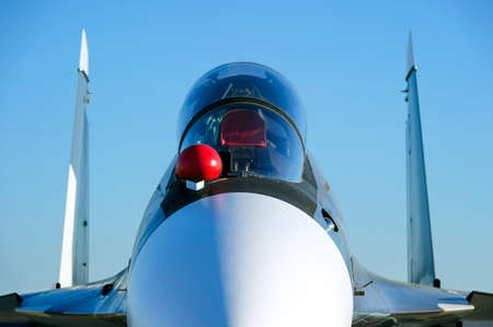 Fighter-bomber jet with empty bulletproof cockpit of military multifunction plane, fourth-generation aircraft, modern army industry, supersonic air force, blue sky on background, selective focusの写真素材