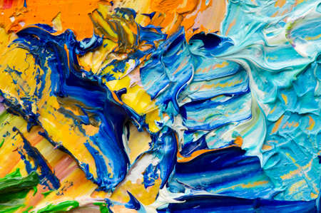 Artist's palette with mixed oil paints, macro, colorful stroke texture on canvas, studio shot, abstract art backgroundの写真素材