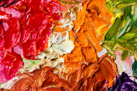 Artist's palette with mixed oil paints, macro, colorful stroke texture on canvas, studio shot, abstract art backgroundの写真素材