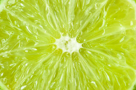 Lime texture, fresh juicy sliced citrus fruit, natural abstract background, macro shotの写真素材