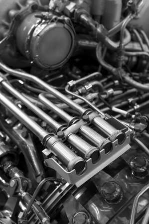 Engine of fighter jet with fuel pipes, hydraulic and other equipment, army aviation, military aircraft and aerospace industry, selective focus, monochrome shotの写真素材
