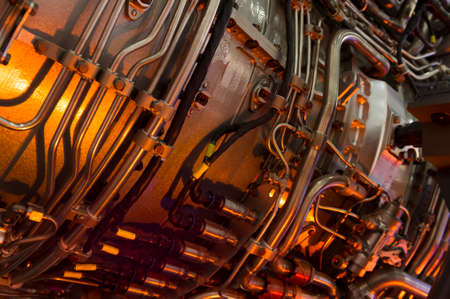 Engine of fighter jet with hydraulic, fuel pipes and other equipment, army aviation, military aircraft and aerospace industry, selective focusの写真素材