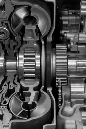 Gear box cross section, engine industry, sprockets, cogwheels and bearings of automotive transmission for oversize trucks and construction vehicles, selective focus, monochrome shotの写真素材
