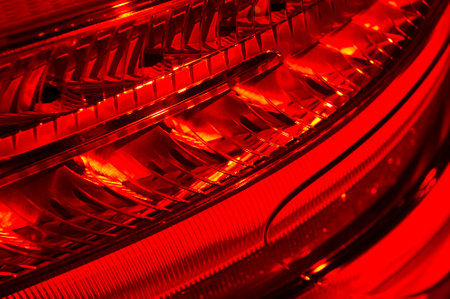 Car red headlight, abstract detail of sedan rear light equipment, automobile industry, selective...