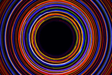 Rotating neon lights, spinning bright colorful laser lights background, modern nightlife and party concept, disco and dancing nightclubs patternの写真素材