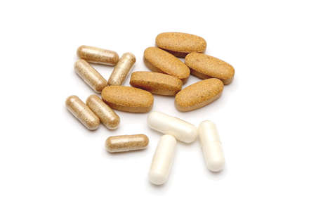 some different pills on white 
