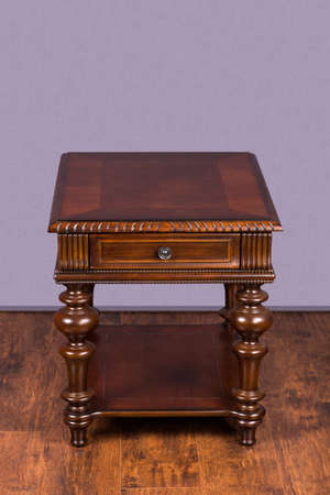 Wooden coffee table on hardwood floor and gray backgroundの写真素材