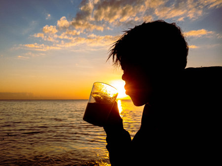 silhouette of people with sunrise on the beach