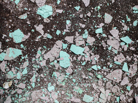 Texture of old rustic wall covered with blue peeling paint. Abstract background for design.